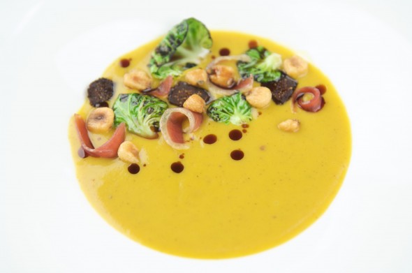 Butternut Squash Soup with Mission Figs, Newsome’s Ham, Fried Hominy, Brussel Sprouts & Pumpkinseed Oil. Made by chef Edward Lee, owner of Louisville's 610 Magnolia and winner of the Iron Chef competition in 2010 and Bravo TV's Top Chef finalist.