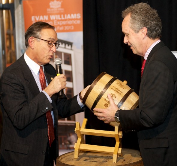 Heaven Hill president (left) Max Shapira presents Louisville mayor Greg Fischer with a unique small barrel of bourbon. The barrel contains product from every member of the Kentucky Distillers Association. 