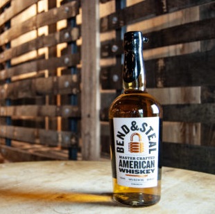 Firefly DIstillery Bend & Steal American Whiskey bottle with staves