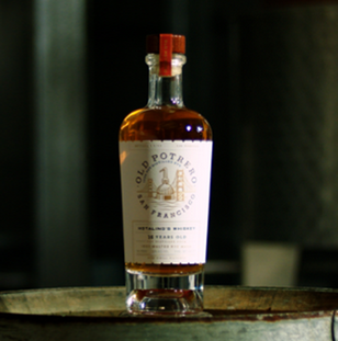 Old Potrero Hotaling Bottled in Bond Rye Whiskey bottle on barrel