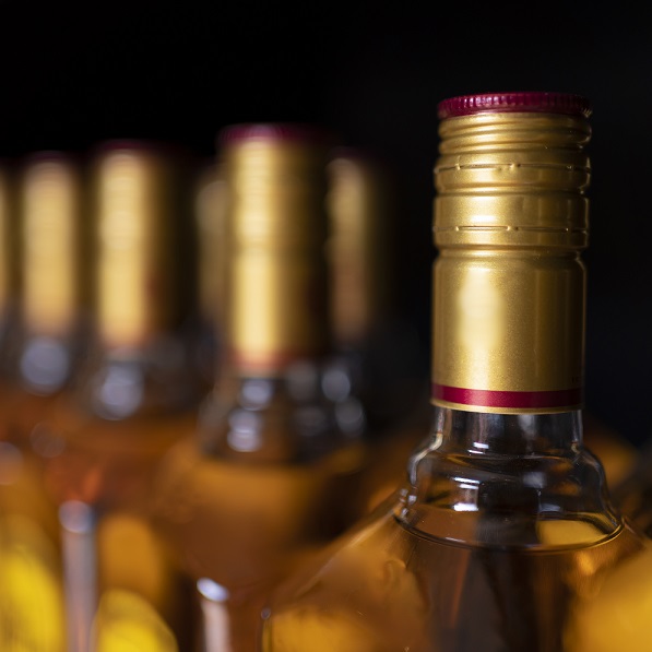 A closeup shot of the bottles of tequila on a black background alcohol