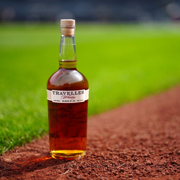 Traveller Whiskey bottle on baseball field