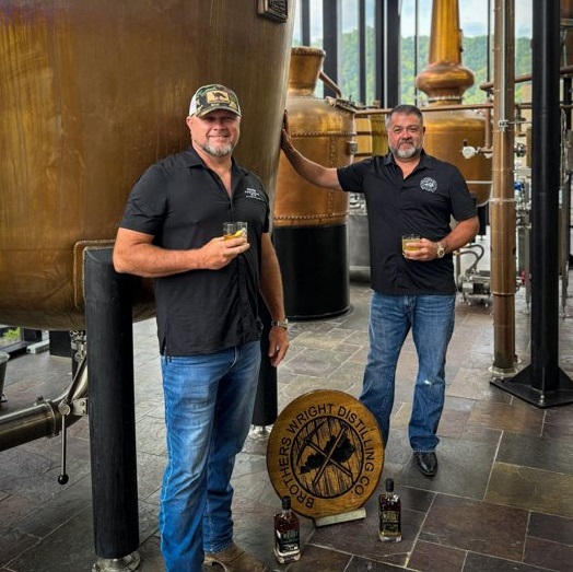 Brothers Wright Distilling founders with still