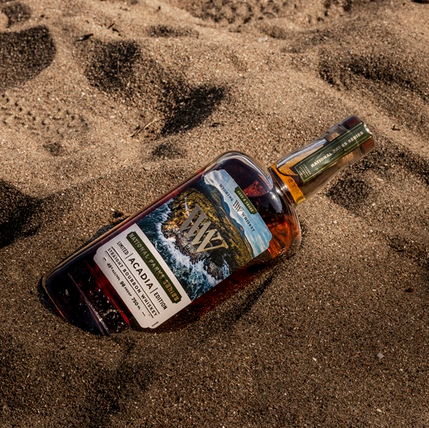 Wyoming Whiskey Parks Acadia Edition bottle in sand