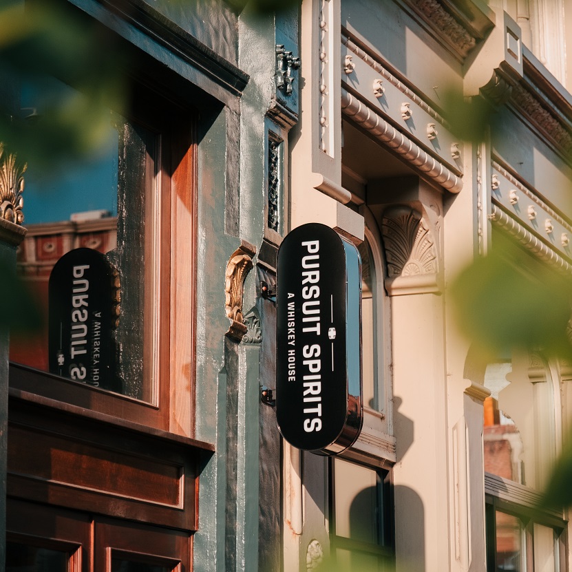 Pursuit Spirits on Whiskey Row sign