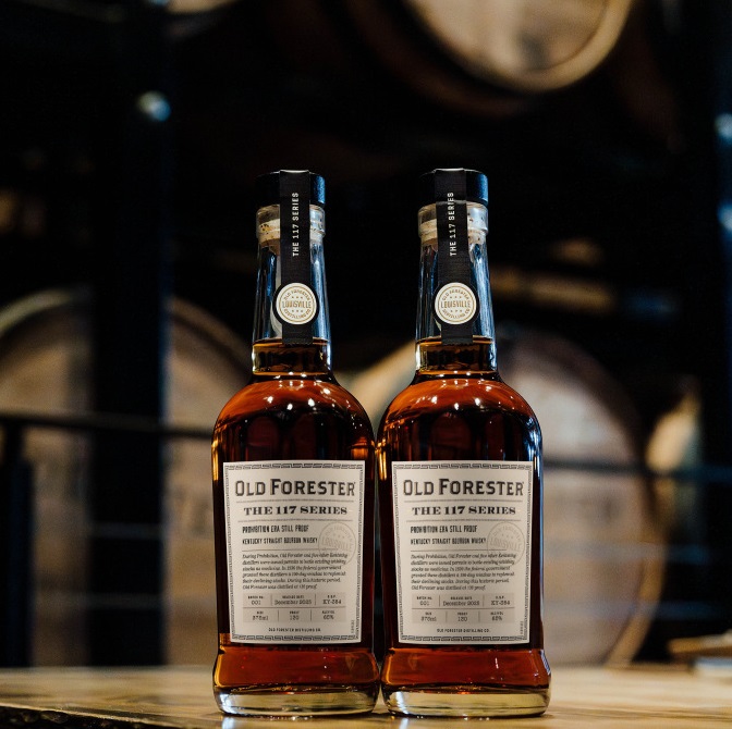 Old Forester 117 Series Prohibition Era Still Proof bottles in rickhouse
