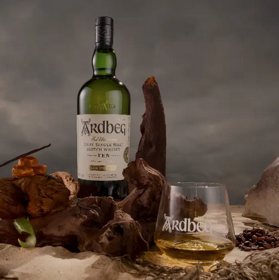 Ardbeg Cask Strength 10-Year-Old bottle with glass in landscape