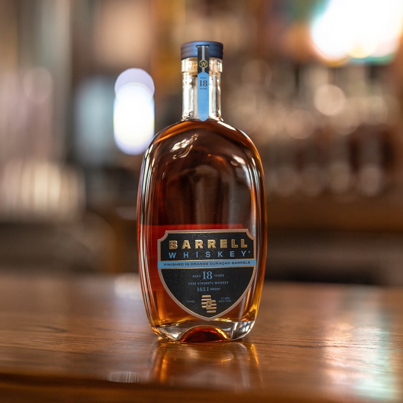 Barrell Hazmat18 yr curacao bottle on bar