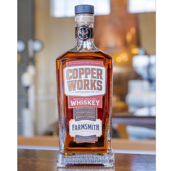 Copperworks Farmsmith Single Malt bottle on bar