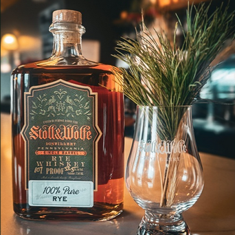 Stoll & Wolfe single barrel bottle with glass and rye