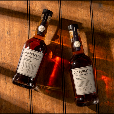 Old Forester 117 Series High Angels’ Share Rye bottles on wood floor