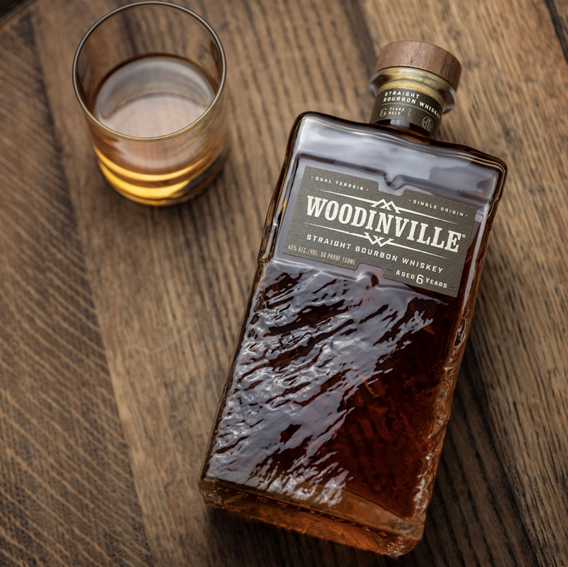 Woodinville Whiskey new bottle design with pour