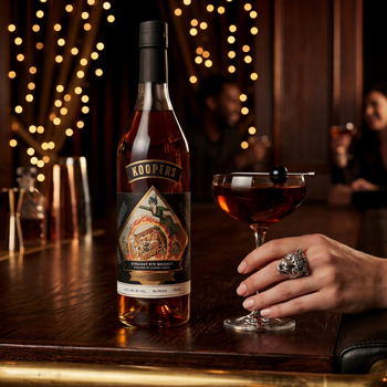 Koopers Whiskey 7-Year Rye Finished in Cognac Casks bottle with cocktail