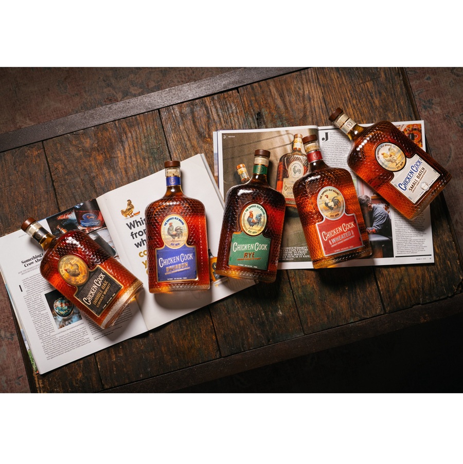 Chicken Cock bottles lying on magazines SQUARE