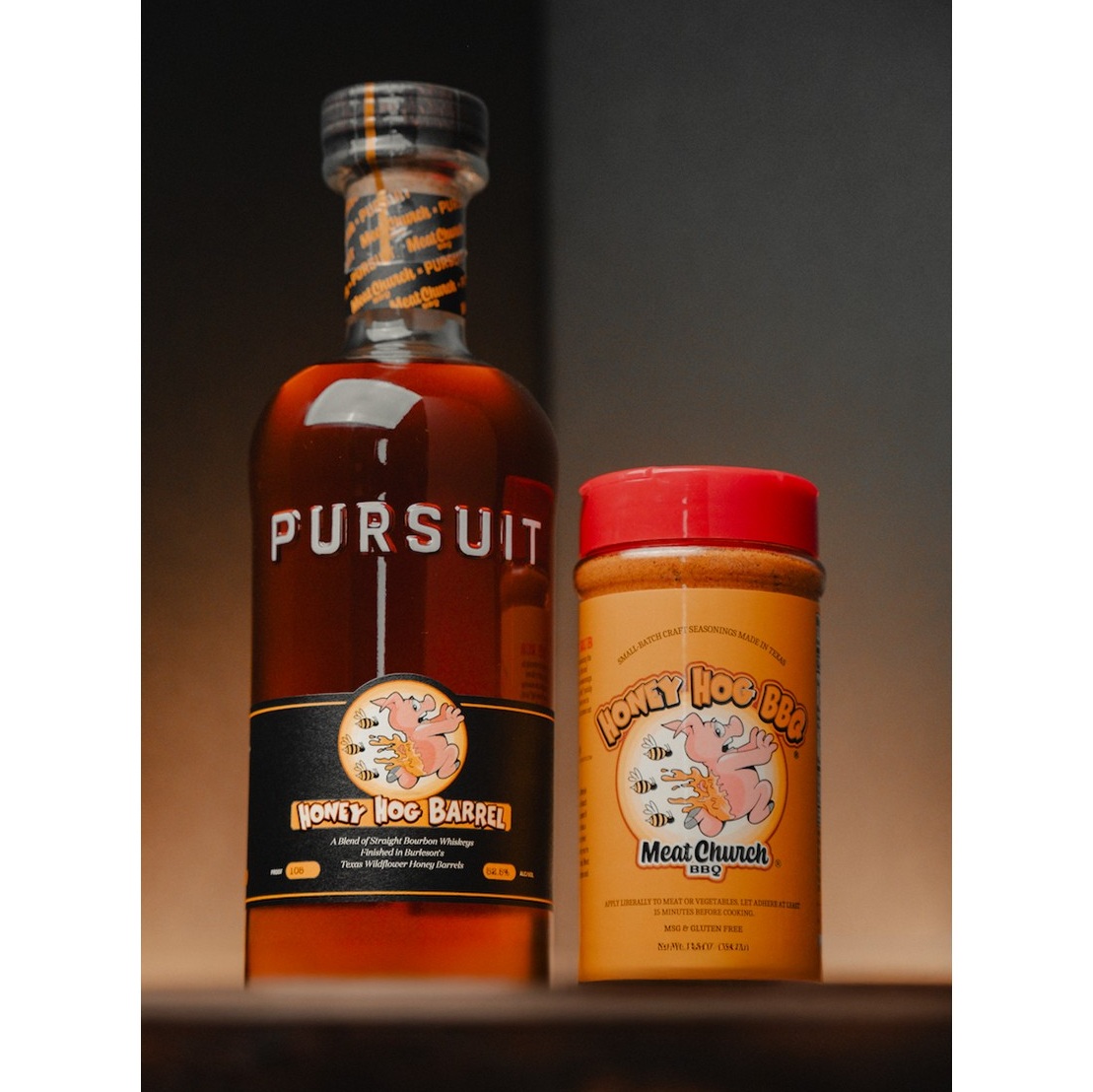 Pursuit Spirits x Meat Church Honey Hog Barrel Bourbon bottle with honey jar SQUARE