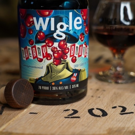 Wigle Whiskey Cherry Bounce bottle with glass