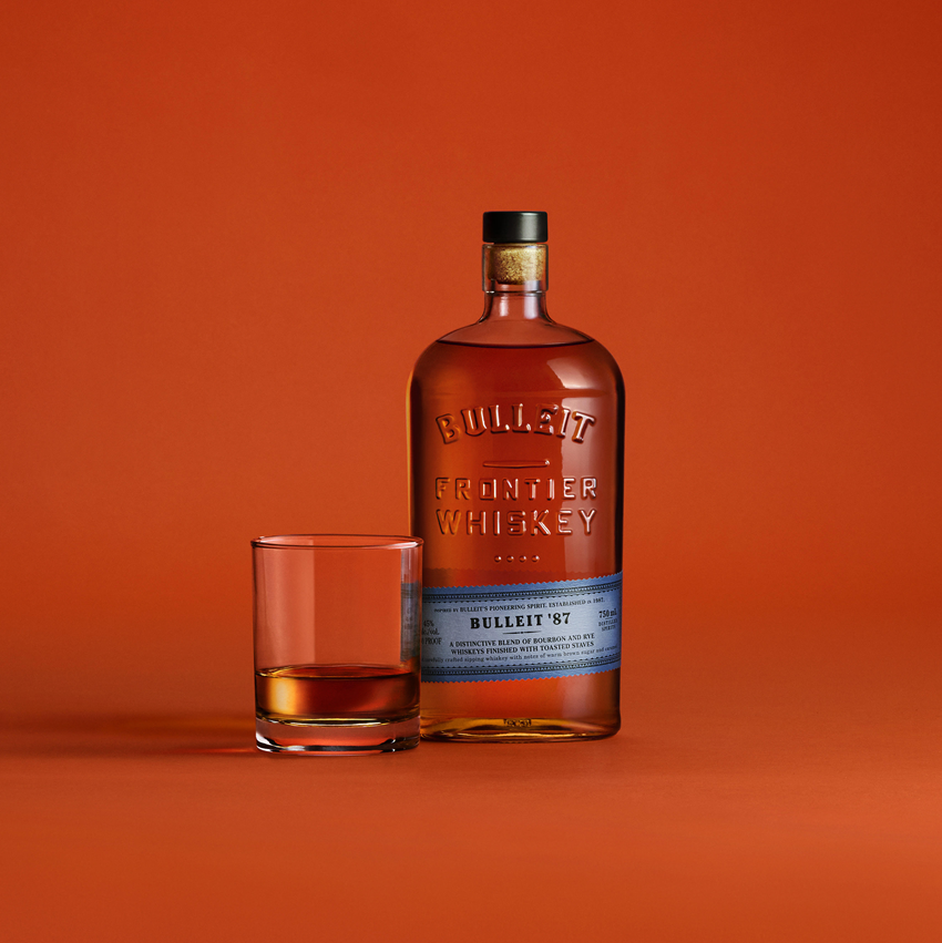 Bulleit '87 Blend bottle with pour