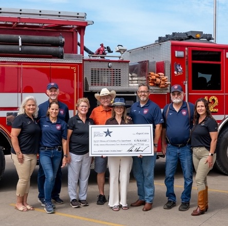 Garrison Brothers donation check fire truck