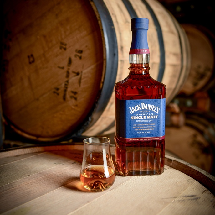 Jack Daniel's American Single Malt bottle and pour on barrel